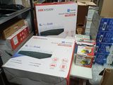 many boxes of electronics on a table in a room