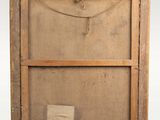 an old wooden frame with a piece of paper hanging from it ' s side