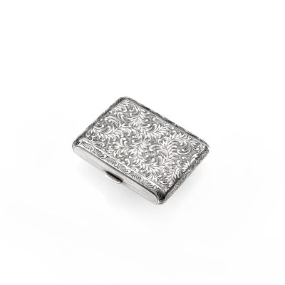 an antique silver cigarette case on a white background