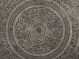 a circular design on the wall of a building
