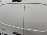 a white van that has a sticker on the side of it