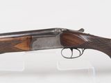 a rifle with a wooden barrel and a metal handle