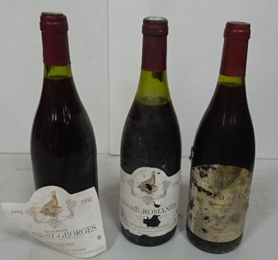 three bottles of wine sitting next to each other on a table