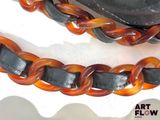 a brown and black leather bracelet with a black clasp