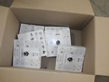 a cardboard box filled with a bunch of electronic devices