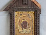 an old wooden picture frame with a picture of a man and a woman
