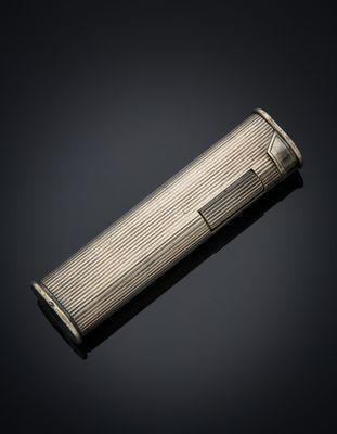 a silver cigarette case on a black background