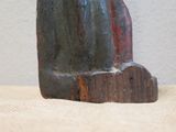 a wooden sculpture of a cat sitting on a table
