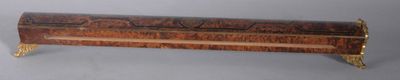 a wooden box with a metal handle on a table