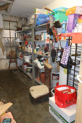 a room with a lot of items on the shelves