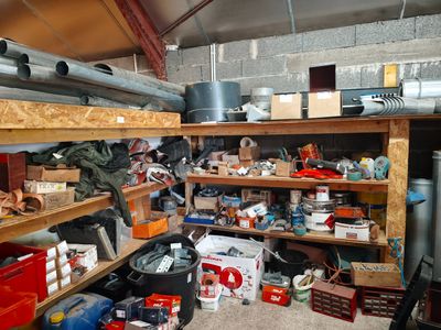 a room filled with lots of clutter and tools
