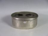 a metal container that has two cups inside of it
