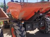 a tractor that is parked on the side of the road