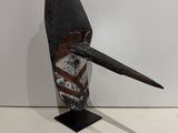 an image of a sculpture of a bird with a long beak
