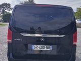 a black van that is parked in a parking lot