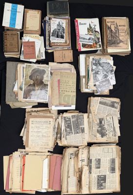 many old books on a black table with a black table cloth