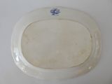 a white plate with a blue and white design on it