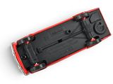 underside view of a red and black skateboard on a white surface