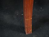 a close up of a wooden table with a black cloth on it