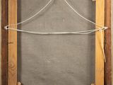 an old wooden frame with a rope hanging from it ' s sides