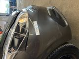 a close up of a car that has been painted black
