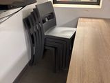two chairs and a table in the corner of a room