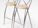 pair of chrome and leather bar stools with cross backrests
