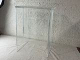 a clear table with a mirror on top of it