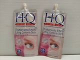 deux tubes de crème pour les yeux Hoo posés sur une surface blanche