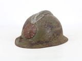 a helmet with a shell on it on a white surface
