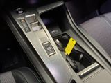 a car dashboard with a phone in the center of it