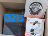 a box with a keyboard, headphones, and a mouse in it
