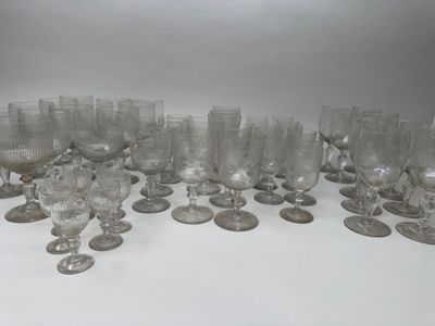a lot of glasses that are sitting on a table