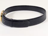 black leather belt with gold buckle on a white background