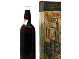 a bottle of liquor that is next to a box