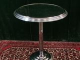 an image of a glass table on a rug