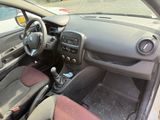 dashboard of a car with a steering wheel and dashboard controls