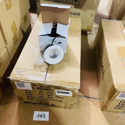 many boxes of toilet paper sitting on top of each other
