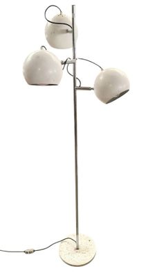 a white lamp that is on a metal pole