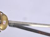 a hand holding a sword with a gold handle