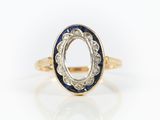 a gold and blue enamel ring with an oval design