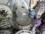 many plates and bowls that are sitting on a table