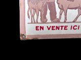 a sign with a picture of a man and two horses