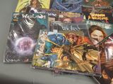 a lot of comic books sitting on a table