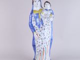 an image of a statue of a woman holding a child