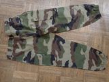 a pair of camouflage pants laying on the floor