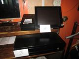 a laptop computer sitting on top of a wooden desk