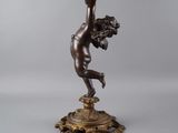 an image of a lamp with a woman holding a flower