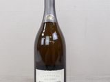 a bottle of wine that is sitting on a table