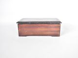 wooden box with black marble top on white background